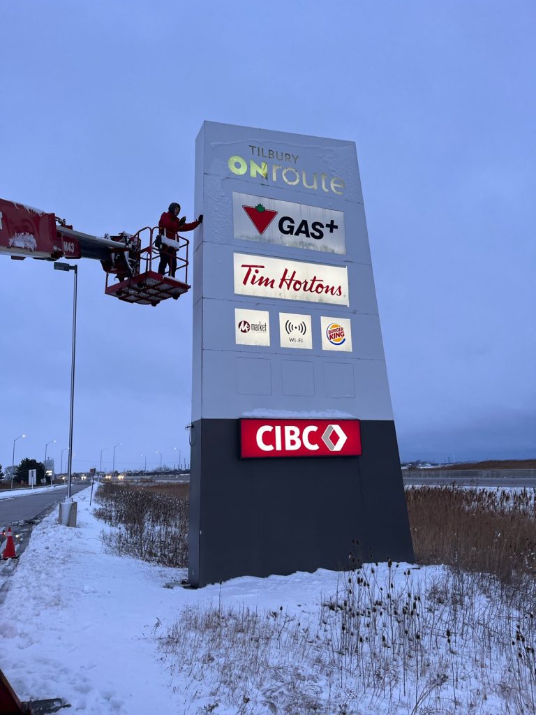 Tilbury ONroute sign being service by YESCO with a bucket ladder